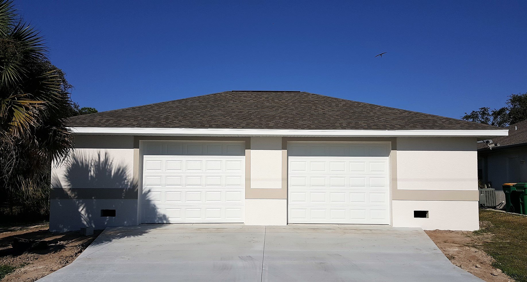 Freshly painted garage exterior on a North Port area home